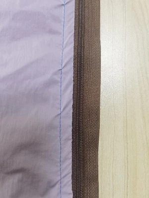 Fig. 3 press the zipper line to push the cloth and hit the rod